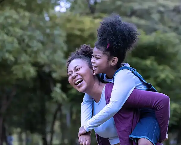 Mother and daughter playing in the park - good mental health - Belleville, IL